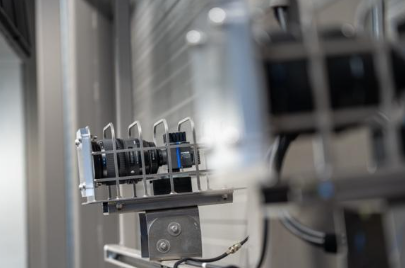 A close-up of mounted camera sensor Kinatrax aligned on a metal rig inside a training facility.